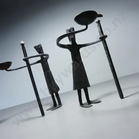 Pair of vintage brutalist metal figural candle holders