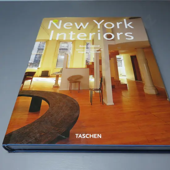 Large coffee table book titled “New York Interiors”