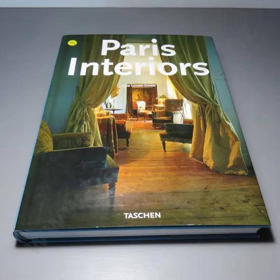 Large coffee table book titled “Paris Interiors”
