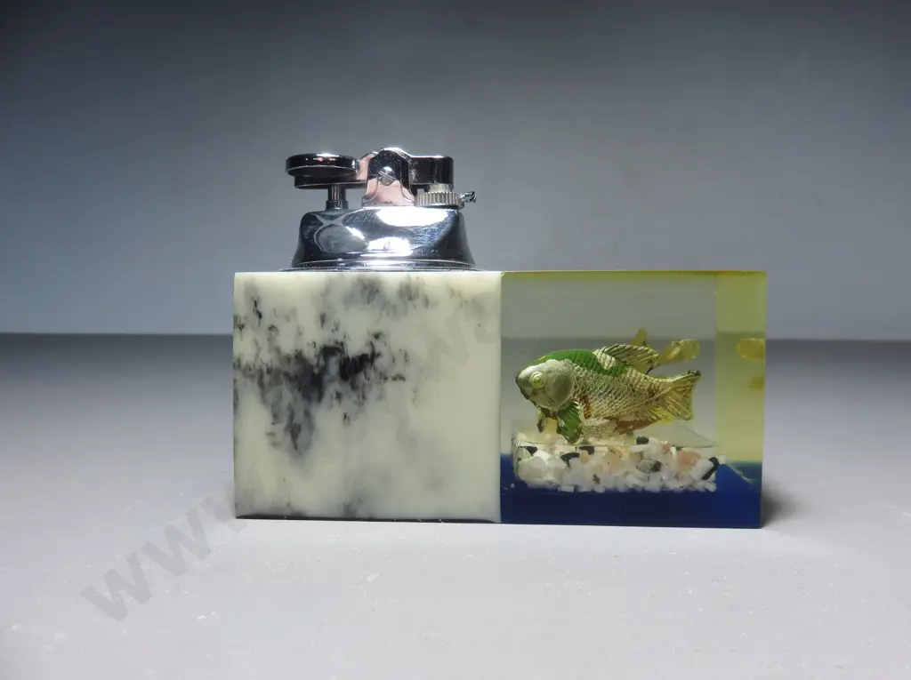 Mid-century table lighter with lucite fish decoration Image 1++