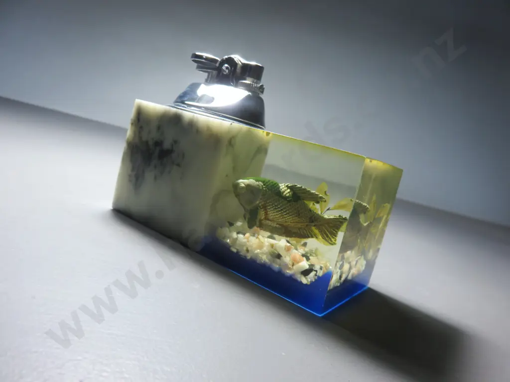 Mid-century table lighter with lucite fish decoration Image 1++