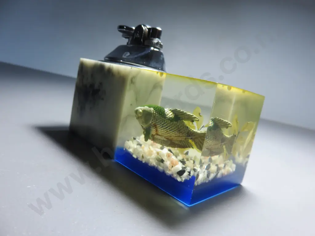 Mid-century table lighter with lucite fish decoration Image 1++