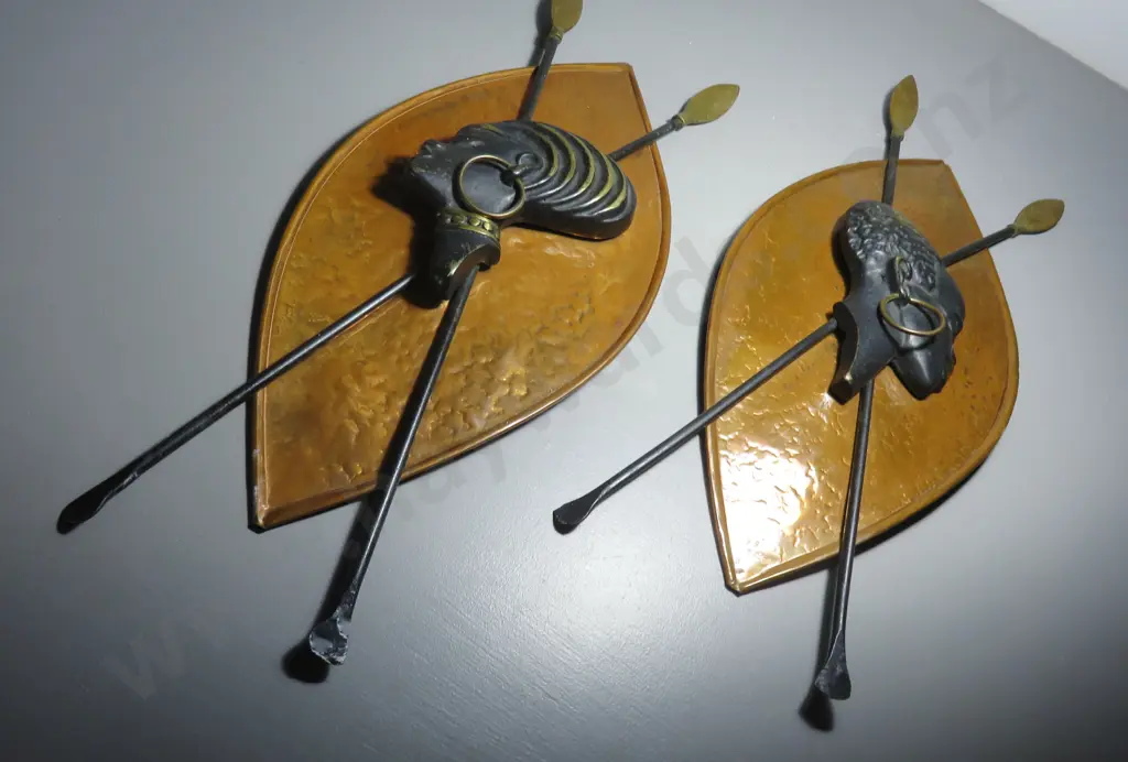Pair of mid-century copper and brass patinated shields Image 1++