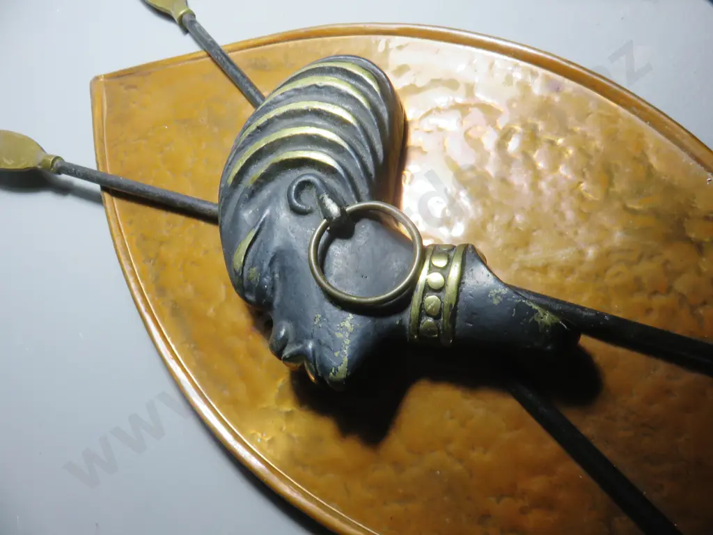 Pair of mid-century copper and brass patinated shields Image 1++