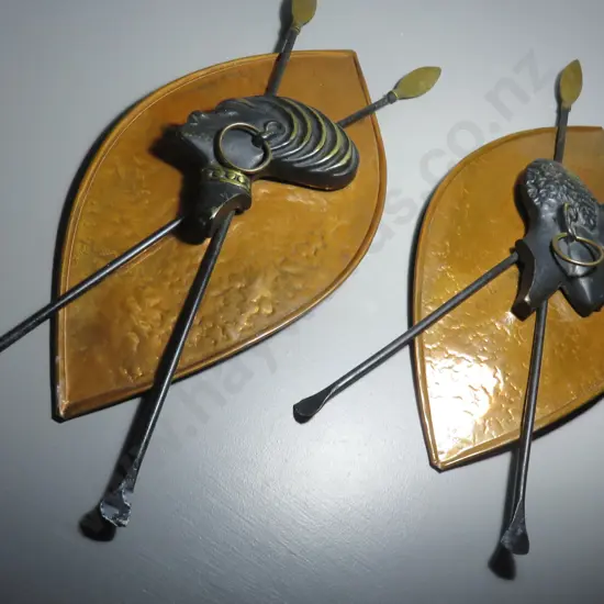 Pair of mid-century copper and brass patinated shields