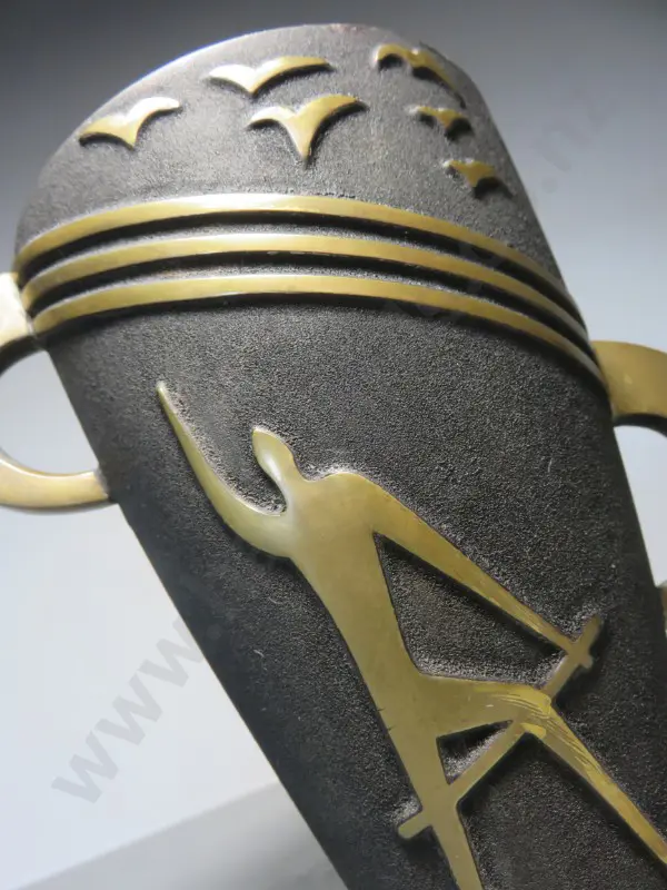 Mid-century brutalist metal vase featuring a figure in raised relief sat below a flock of birds Image 1++