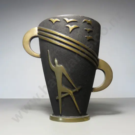 Mid-century brutalist metal vase featuring a figure in raised relief sat below a flock of birds