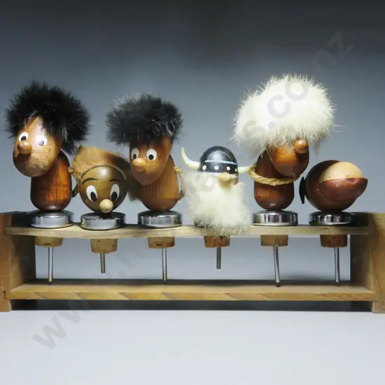 Set of six mid-century Danish teak timber and fur Bottle tops