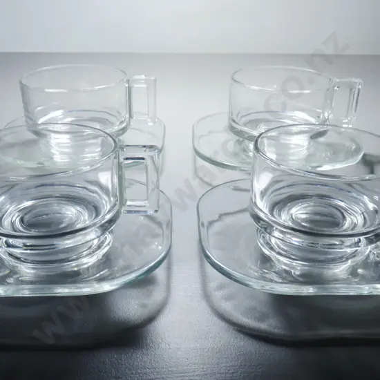 Set of four Italian Joe Colombo glass coffee cups and saucers