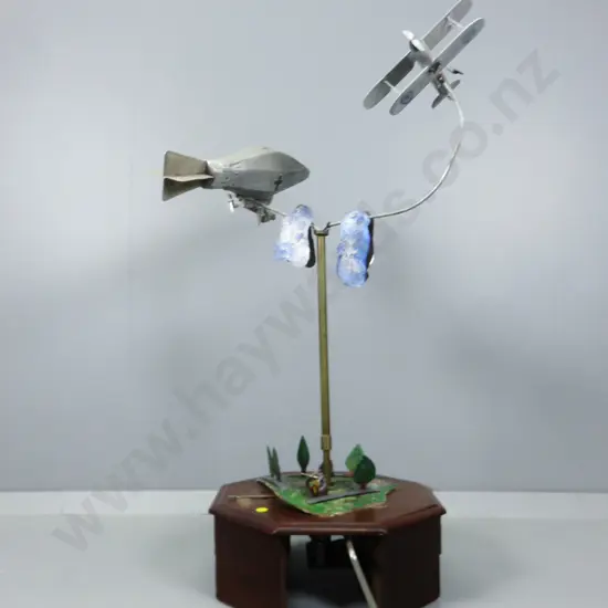 Early 20th century automaton featuring a world war one Biplane chasing a German Zeppelin