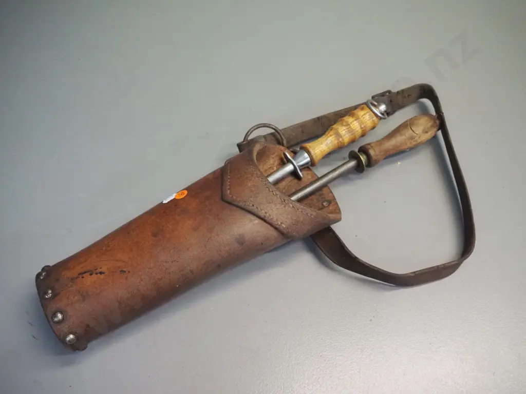 heavy studded leather butchers holster with 2 wooden handled sharpening steels. Container L-320 Image 1++
