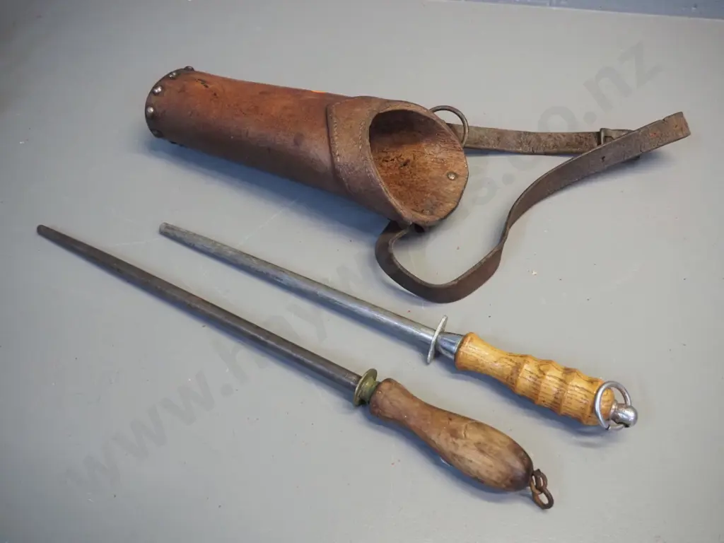 heavy studded leather butchers holster with 2 wooden handled sharpening steels. Container L-320 Image 1++