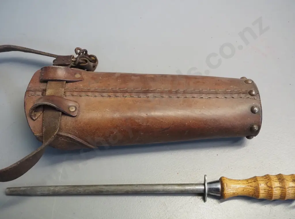 heavy studded leather butchers holster with 2 wooden handled sharpening steels. Container L-320 Image 1++