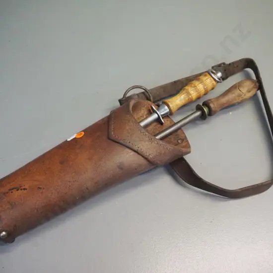 heavy studded leather butchers holster with 2 wooden handled sharpening steels. Container L-320
