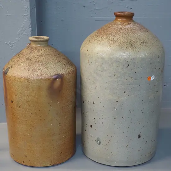 2 stoneware narrow-mouth crocks - very large, no mark, H540 - and a Kempthorne Prosser Dunedin with handle broken off