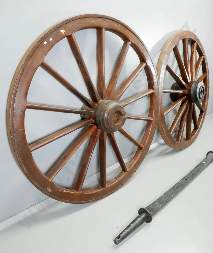 2 large dray wheels and a cast iron axle with tapered ends L-2110, Wheels have iron bands D-1490 Image 1++