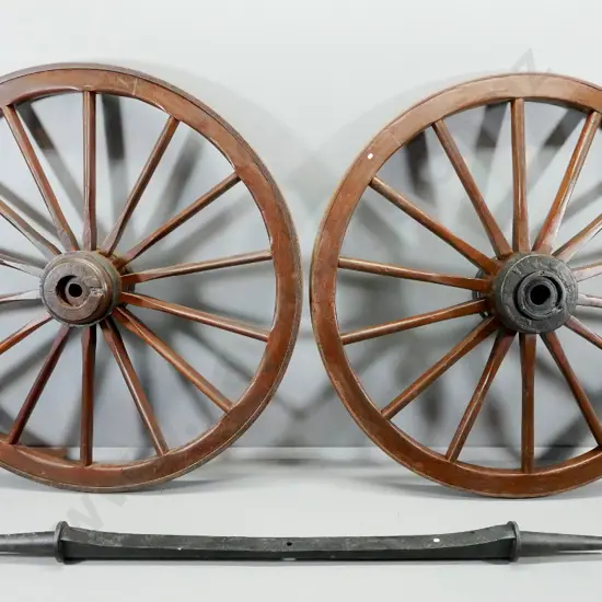 2 large dray wheels and a cast iron axle with tapered ends L-2110, Wheels have iron bands D-1490