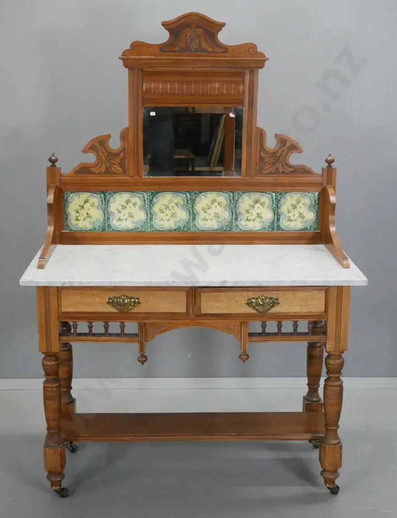 vintage kauri wash-stand with marble top, tiles and bevelled mirror in carved upstand, 2 drawers w/mottled fronts & drop Image 1++