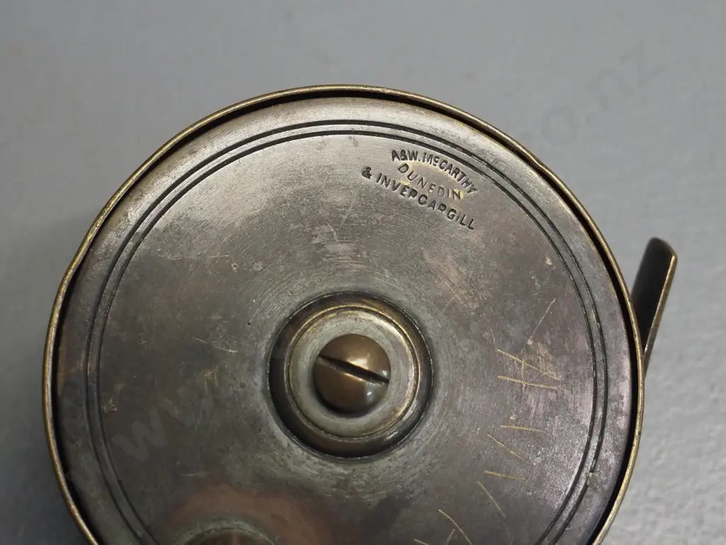 2 vintage metal fishing reels - brass A&W. McCarthy Dunedin & Invercargill, other unmarked D-85 Image 1++