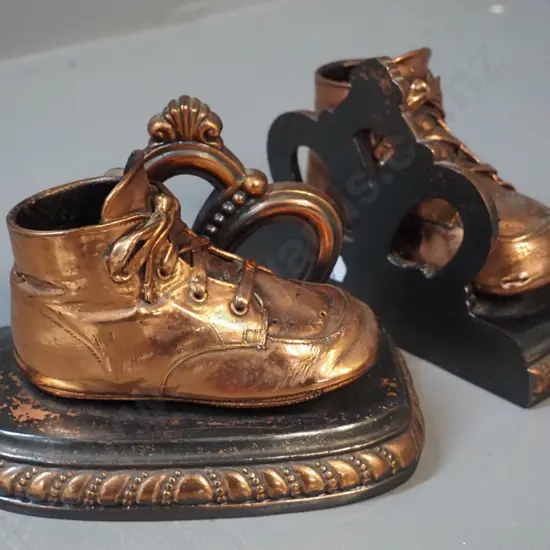 pair of cast and sheet copper child's shoe book-ends w/weighted bases H-120 W-165