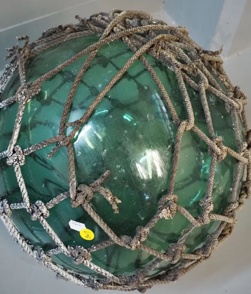 vintage green glass fishing float with rope netting surround - netting is coming apart in places D-300 Image 1++