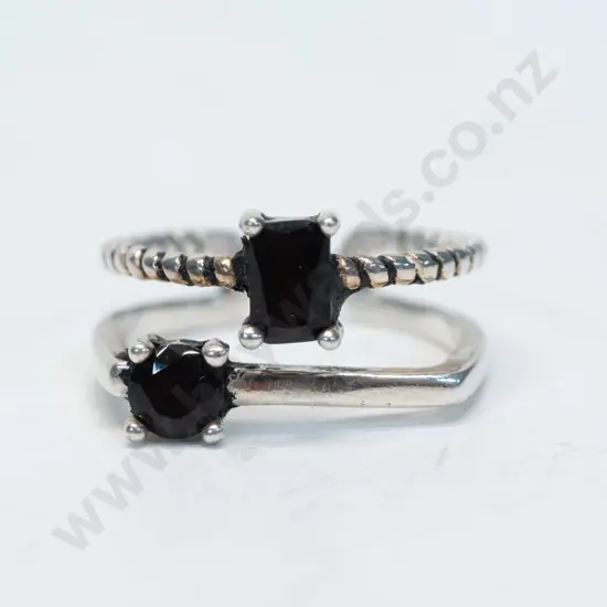 silver double ring with dark stones joined together at base stamped 925