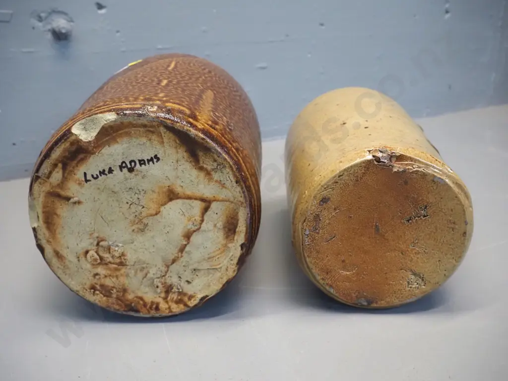 2 narrow mouth stoneware crocks, no marks but one with chip has Luke Adams written in pen on bottom H-310 D-170 Image 1++