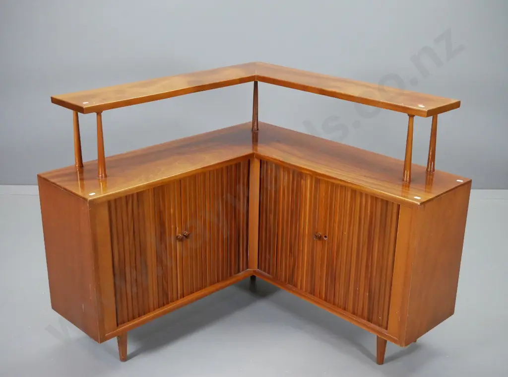 mid-century mahogany corner cabinet with top shelf, 2 cupboards w/ double tambour doors, one handle missing Image 1++