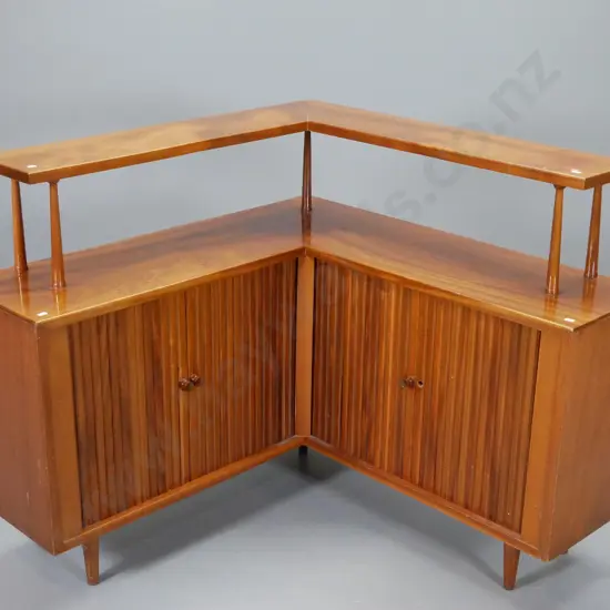 mid-century mahogany corner cabinet with top shelf, 2 cupboards w/ double tambour doors, one handle missing