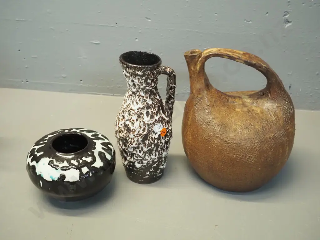 studio pottery items: coarse textured brown ewer jug H230, black & white bowl (unknown mark) & German pottery vase Image 1++