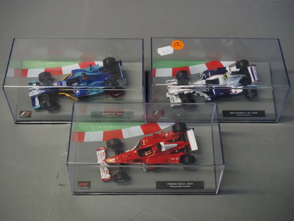3 die-cast 1:43 scale Formula 1 racing cars - 2004 Rubens Varrcello, 2004 Felipe Massa, 2008 Robert Kubica Image 1++