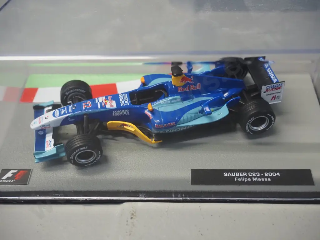 3 die-cast 1:43 scale Formula 1 racing cars - 2004 Rubens Varrcello, 2004 Felipe Massa, 2008 Robert Kubica Image 1++