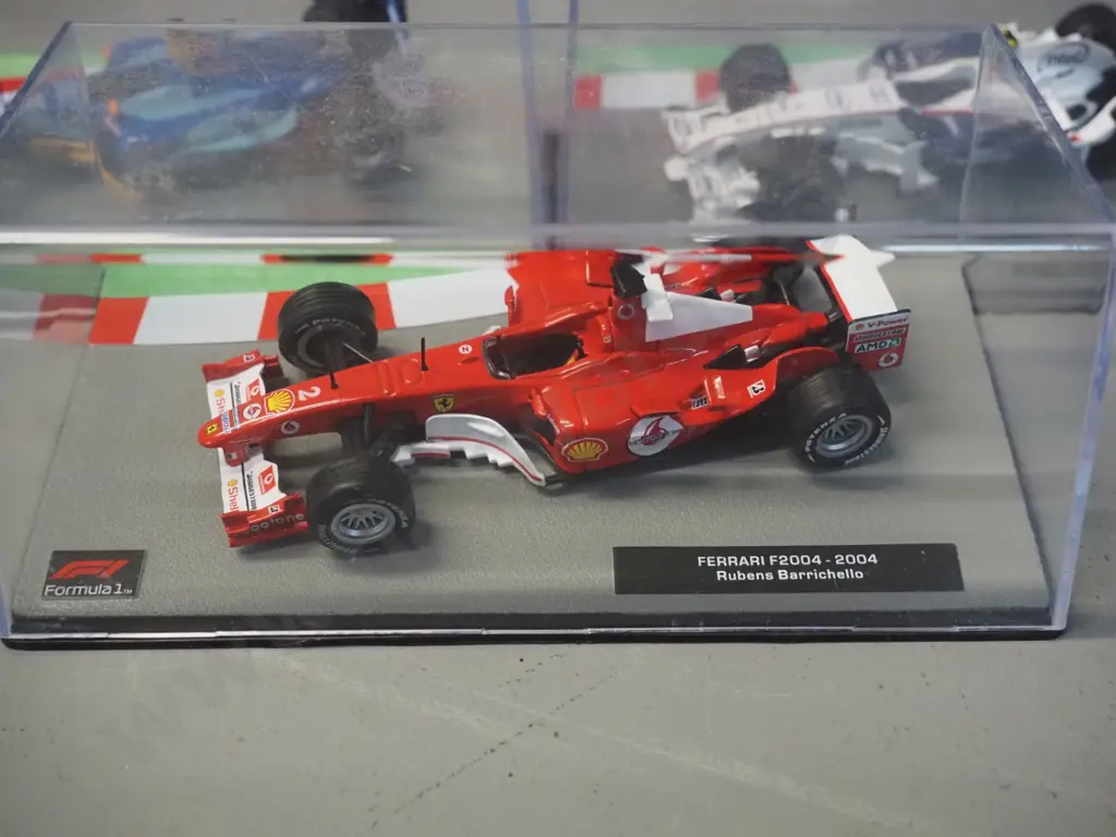3 die-cast 1:43 scale Formula 1 racing cars - 2004 Rubens Varrcello, 2004 Felipe Massa, 2008 Robert Kubica Image 1++