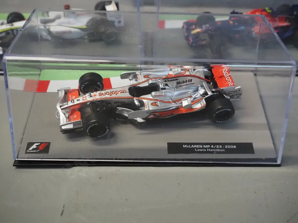 3 die-cast 1:43 scale Formula 1 racing cars - 2008 Lewis Hamilton, 2008 Sebastian Vettel, 2009 Jason Button Image 1++