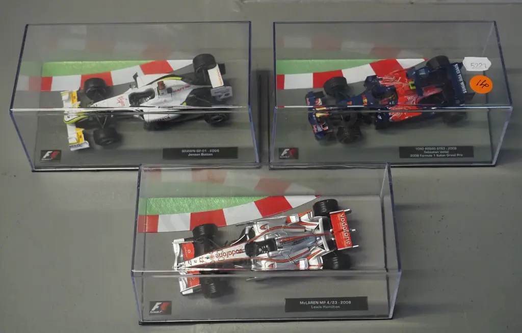 3 die-cast 1:43 scale Formula 1 racing cars - 2008 Lewis Hamilton, 2008 Sebastian Vettel, 2009 Jason Button Image 1++