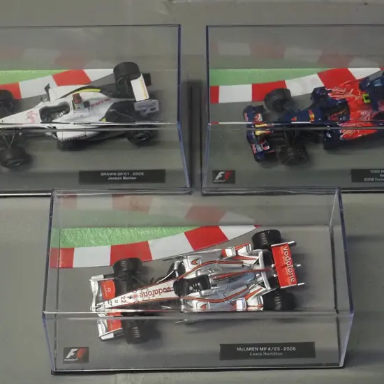3 die-cast 1:43 scale Formula 1 racing cars - 2008 Lewis Hamilton, 2008 Sebastian Vettel, 2009 Jason Button