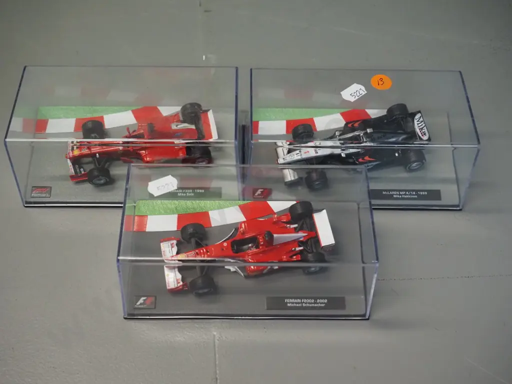 3 die-cast 1:43 scale Formula 1 racing cars - 1999 Mika Hakkinen, 1999 Mika Salo, 2002 Michael Schumacher, Image 1++