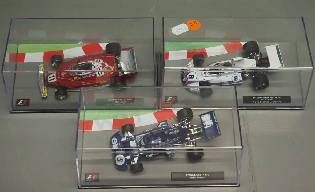 3 die-cast 1:43 scale Formula 1 racing cars - 1973 Jackie Stewart, 1975 Carlos Pace, 1977 Niki Lauder Image 1++