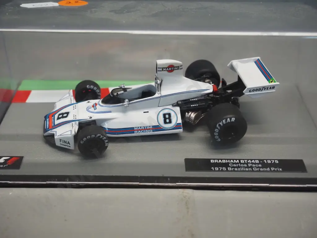 3 die-cast 1:43 scale Formula 1 racing cars - 1973 Jackie Stewart, 1975 Carlos Pace, 1977 Niki Lauder Image 1++