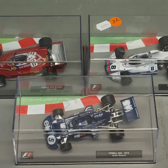 3 die-cast 1:43 scale Formula 1 racing cars - 1973 Jackie Stewart, 1975 Carlos Pace, 1977 Niki Lauder