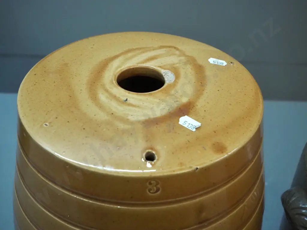 2 stoneware crocks - dispensing barrel shaped crock with chip to stopper & mouth H370, storage crock with wooden lid Image 1++