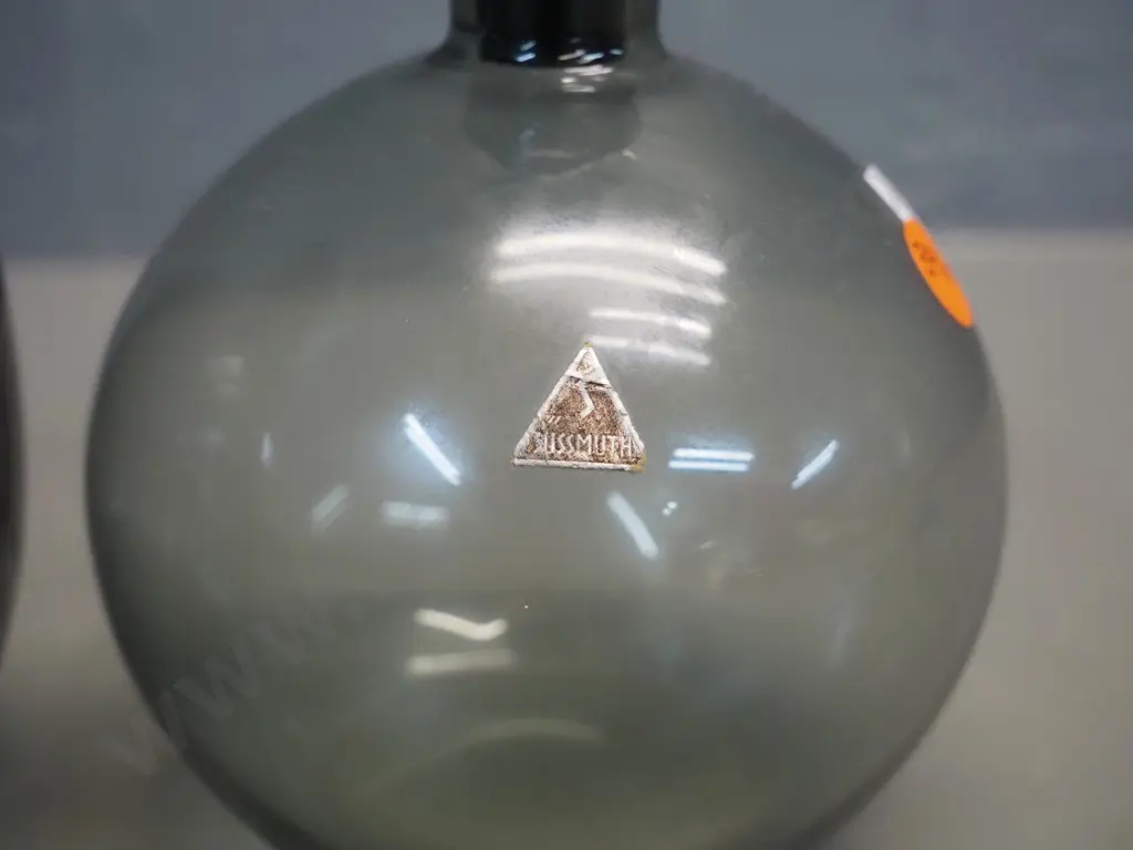 2 smoked glass stoppered bottles - larger H200, other has Sussmuth label, both need cleaning inside Image 1++