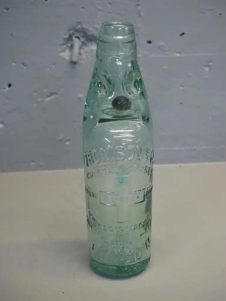 Thompsons Dunedin marble bottle with black marble - 1905 on base Image 1++