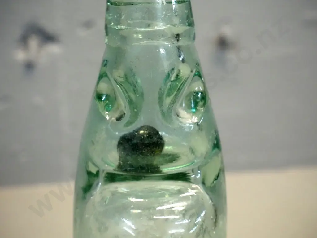 Thompsons Dunedin marble bottle with black marble - 1905 on base Image 1++