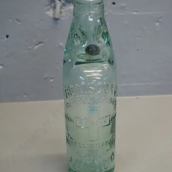 Thompsons Dunedin marble bottle with black marble - 1905 on base