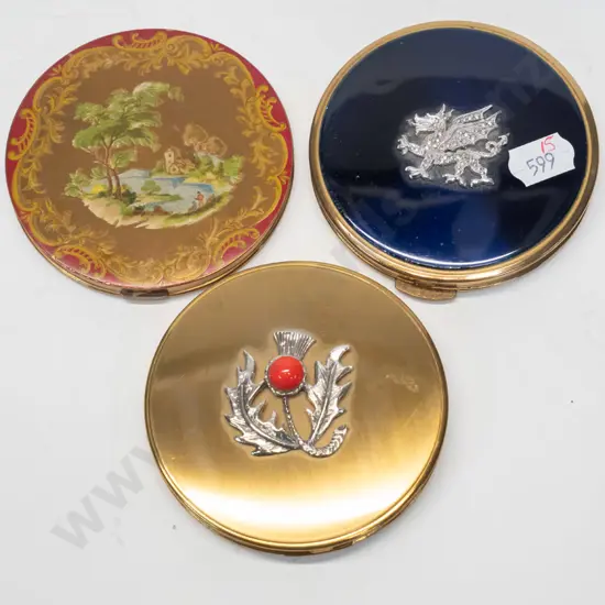 3 powder compacts - 1 with thistle, 1 with dragon, 1 with country scene also mirror is broken