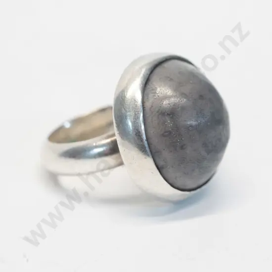 silver ring with opaque stone stamped stg