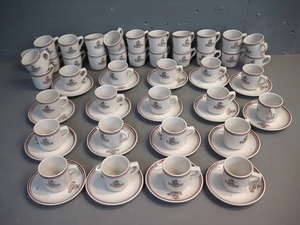 large quantity of Crown Lynn espresso cups & saucers with Invercargill Licensing Trust logo - 40 cups & 18 saucers Image 1++
