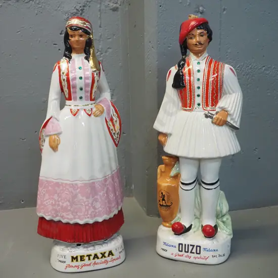 pair of Italian ceramic figural decanters - Metaxa / Ouzo female H470 and male has repair to neck