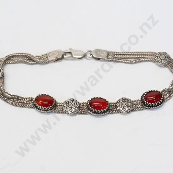 silver bracelet with 3 red onyx stones